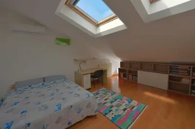 Letto o letti in una camera di Stanza con bagno privato