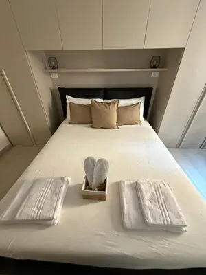 Letto o letti in una camera di Suite Piazzetta Vigo