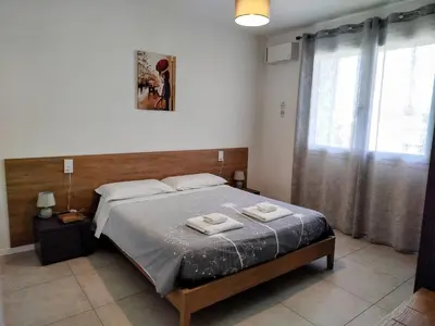 Letto o letti in una camera di Appartamento ROVERE