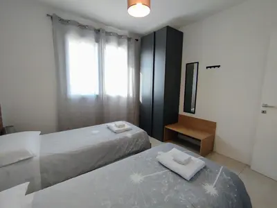 Letto o letti in una camera di Appartamento ROVERE