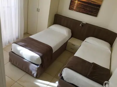 Letto o letti in una camera di Residenza Roma Marina