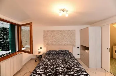 Letto o letti in una camera di San Marco Wi-Fi