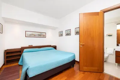 Letto o letti in una camera di Residence Ca' Foscolo