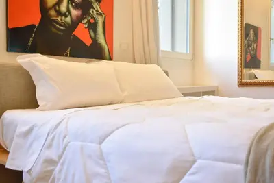 Letto o letti in una camera di Welc-ōM Palazzo Gabelli Free Parking