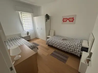 Letto o letti in una camera di Cozy Corner Treviso Station #4