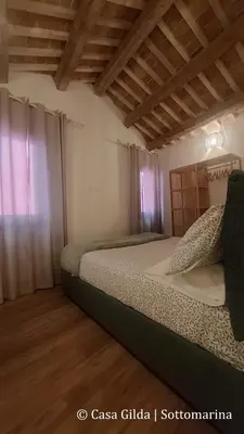 Letto o letti in una camera di Casa Gilda
