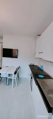 Cucina o angolo cottura di APPARTAMENTO BLU -OVER THE RAINBOW APARTMENTS - LIDO di JESOLO- check in check out on Saturday