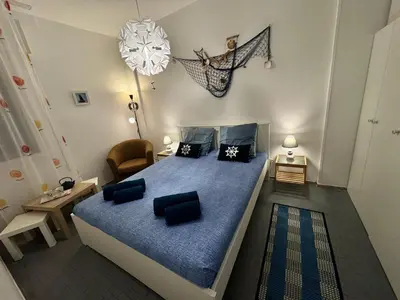 Letto o letti in una camera di Casa Angela by Ca-Sa Check