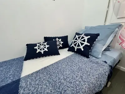 Letto o letti in una camera di Casa Angela by Ca-Sa Check