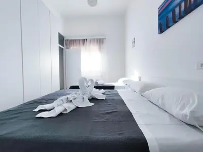 Letto o letti in una camera di Ariston Superior Fronte Mare