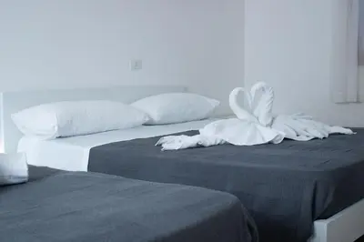 Letto o letti in una camera di Ariston Superior Fronte Mare