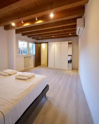Letto o letti in una camera di HOUSE RIVA casa VENEZIA - Dolo