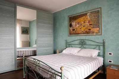 Letto o letti in una camera di Elegante Alloggio con Parcheggio Gratuito