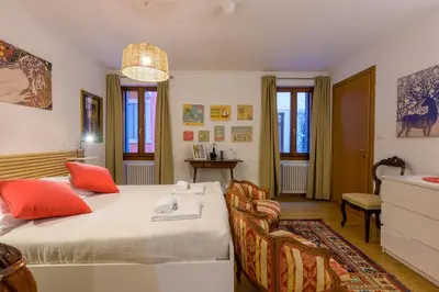 Letto o letti in una camera di Teatro alla Fenice - Bealux Srl