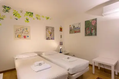 Letto o letti in una camera di Teatro alla Fenice - Bealux Srl