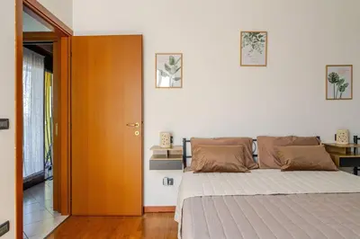 Letto o letti in una camera di Venice Home vicino aeroporto di Venezia e H Farm college parcheggio gratuito