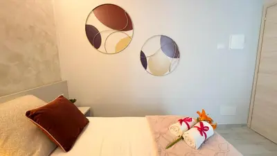 Letto o letti in una camera di Do Campanili by Ca-Sa Check