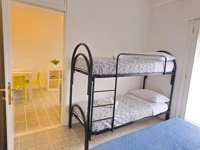 Letto o letti in una camera di Bilocale Augustus Piazza Mazzini