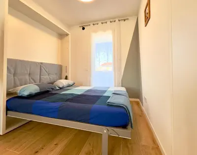 Letto o letti in una camera di 20 min Venezia Modern Apartament with terrace