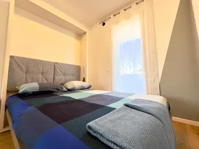 Letto o letti in una camera di 20 min Venezia Modern Apartament with terrace