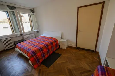 Letto o letti in una camera di GRANDMA MARY Appartamento nel verde con Ascensore Balcone AC Internet Veloce GIUDECCA VENEZIA