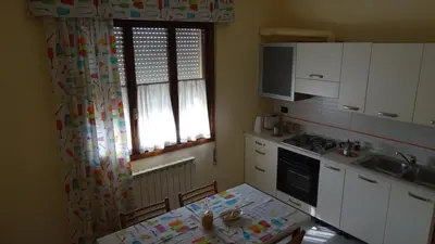 Cucina o angolo cottura di Il Giardino dei Ciliegi appartamento con 3 camere