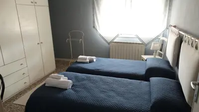 Letto o letti in una camera di Il Giardino dei Ciliegi appartamento con 3 camere