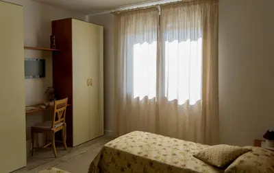Letto o letti in una camera di B&B La Rinascita