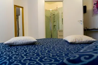 Letto o letti in una camera di B&B La Rinascita