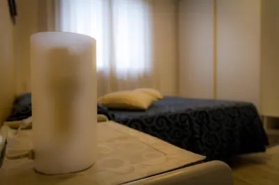 Letto o letti in una camera di B&B La Rinascita