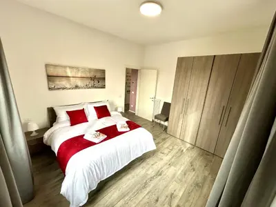 Letto o letti in una camera di Lovely Bridge View Apartment Close to Padua City Center