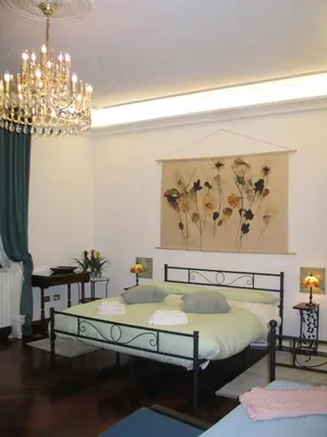Letto o letti in una camera di Palladio House, spaziosa elegante e centrale