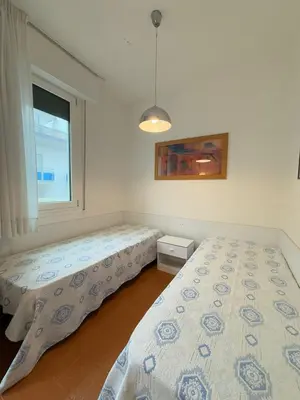 Letto o letti in una camera di RESIDENCE PALMAR -Solo per famiglie -WALTERIGATO APARTMENTS