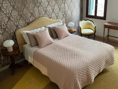 Letto o letti in una camera di Terrazzi su Piazza San Marco