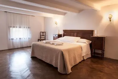 Letto o letti in una camera di Palazzo Valmarana