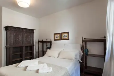 Letto o letti in una camera di Palazzo Valmarana