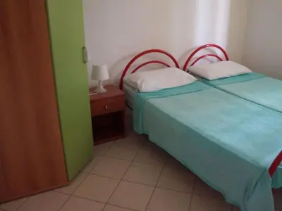 Letto o letti in una camera di Berta