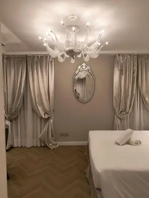 Letto o letti in una camera di Cà dell'Arte Boutique