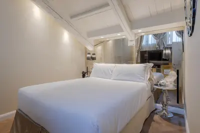 Letto o letti in una camera di Cà dell'Arte Boutique