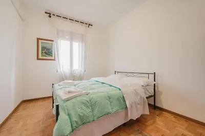 Letto o letti in una camera di Residence Gerlin - 10 minuti da Valdobbiadene & Parking