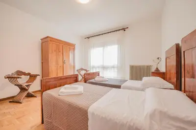 Letto o letti in una camera di Residence Gerlin - 10 minuti da Valdobbiadene & Parking
