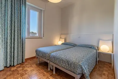 Letto o letti in una camera di Oleaclub Locazione Turistica