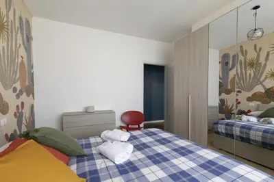 Letto o letti in una camera di Cozy Apt - Close to City Center and Train Station