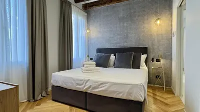Letto o letti in una camera di Rialto Prestige Canal View