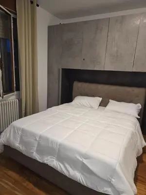 Letto o letti in una camera di B&B Via Pitagora
