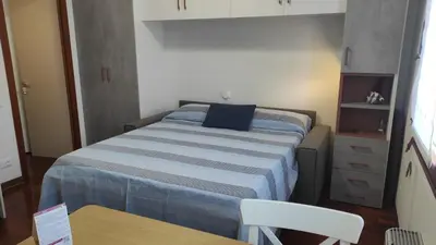 Letto o letti in una camera di Nido in centro - no ztl - zona Università, piano 1 con ascensore, clima e wi-fi - Keki