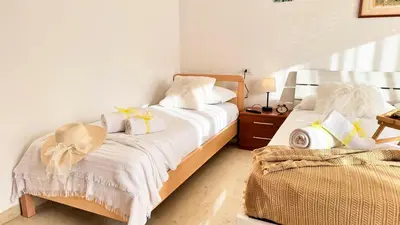 Letto o letti in una camera di Casa Dora by Ca-Sa Check
