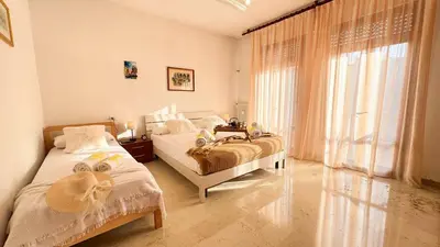 Letto o letti in una camera di Casa Dora by Ca-Sa Check