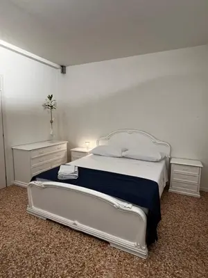 Letto o letti in una camera di Locazione Turistica Joyful Padova