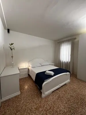Letto o letti in una camera di Locazione Turistica Joyful Padova